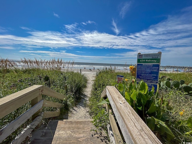 view of home's community with a view of the beach and a water view