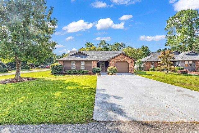 ranch-style house with a front yard and a garage