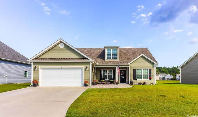 view of front facade featuring a front yard and a garage