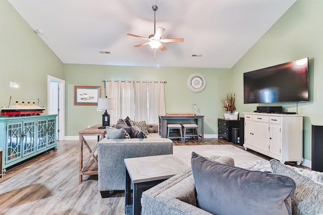 living room with light wood-type flooring, lofted ceiling, and ceiling fan