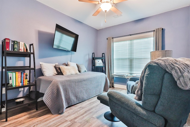 bedroom featuring ceiling fan and hardwood / wood-style floors