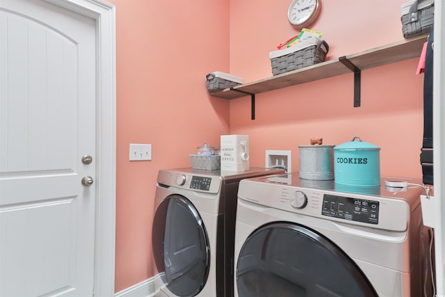 washroom featuring washing machine and dryer