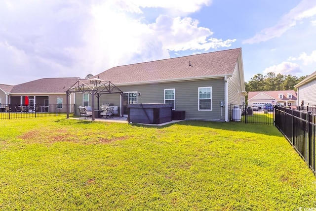 rear view of property with a lawn and a patio area