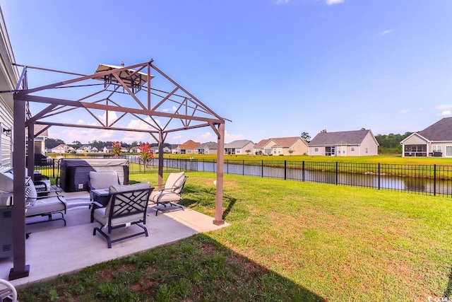 view of yard featuring a patio and a water view