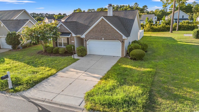 view of front of property featuring a garage and a front yard