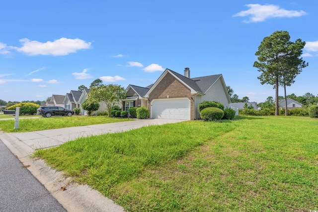 view of front of house with a front yard and a garage