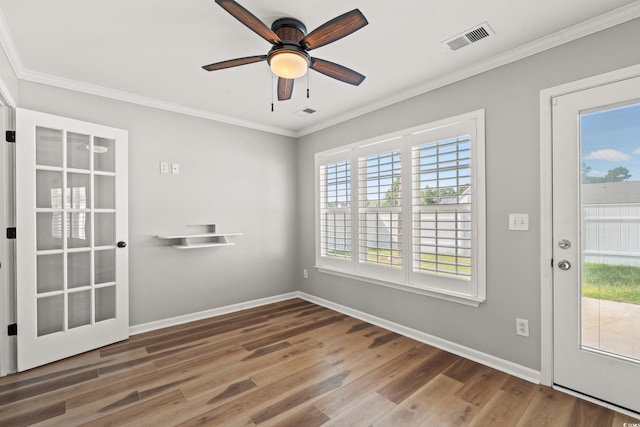 interior space featuring crown molding, ceiling fan, and dark hardwood / wood-style floors