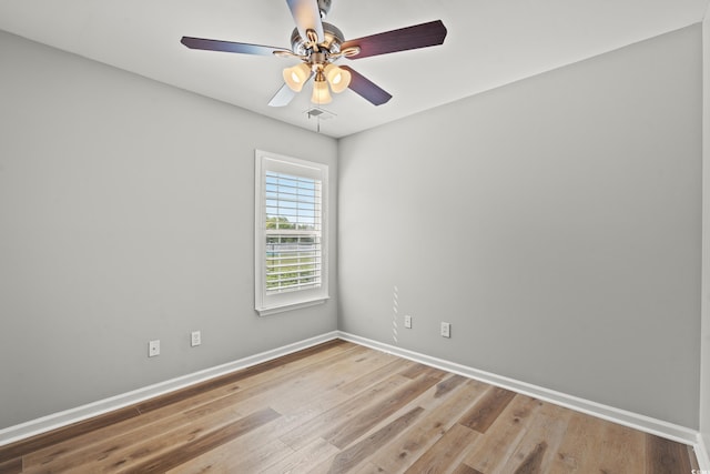 unfurnished room with hardwood / wood-style flooring and ceiling fan