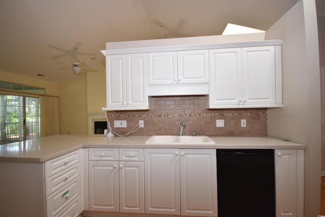 kitchen with decorative backsplash, dishwasher, white cabinets, a peninsula, and a sink