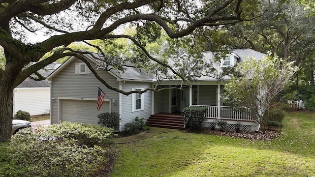 view of front of home with a garage, a front lawn, and a porch