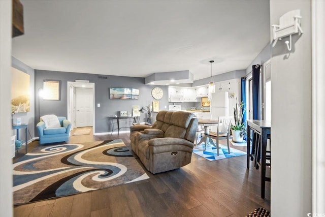 living room with dark hardwood / wood-style floors