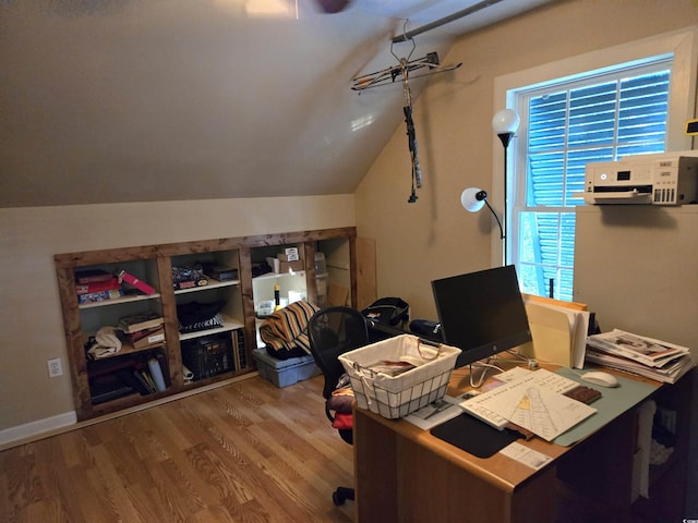home office with hardwood / wood-style flooring and lofted ceiling
