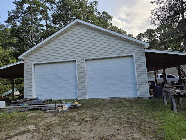 garage featuring a carport