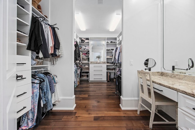 spacious closet featuring dark wood-style flooring and visible vents