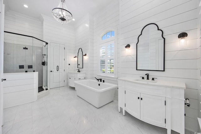 bathroom with independent shower and bath, a chandelier, crown molding, and vanity