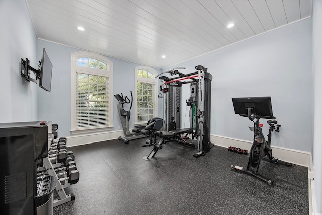 exercise room featuring recessed lighting, wood ceiling, and baseboards