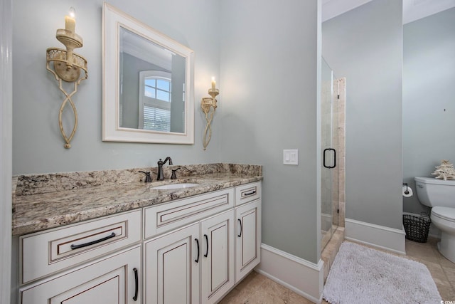 bathroom with tile patterned flooring, toilet, vanity, baseboards, and a shower stall