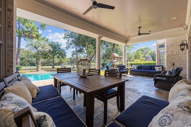 view of patio / terrace with a fenced in pool, ceiling fan, and outdoor lounge area