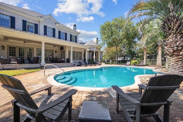 pool featuring french doors, a patio area, and ceiling fan