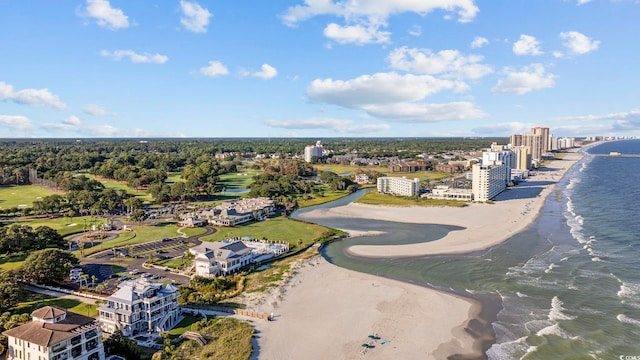 birds eye view of property featuring a beach view and a water view