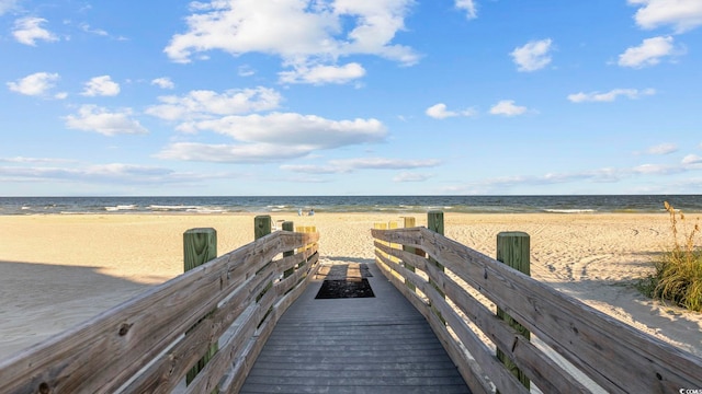 view of community with a view of the beach and a water view