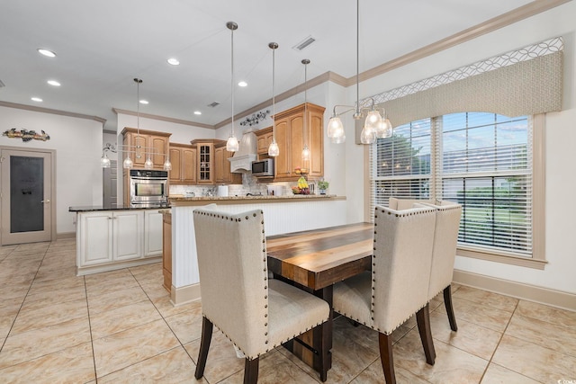 dining area featuring a chandelier and ornamental molding