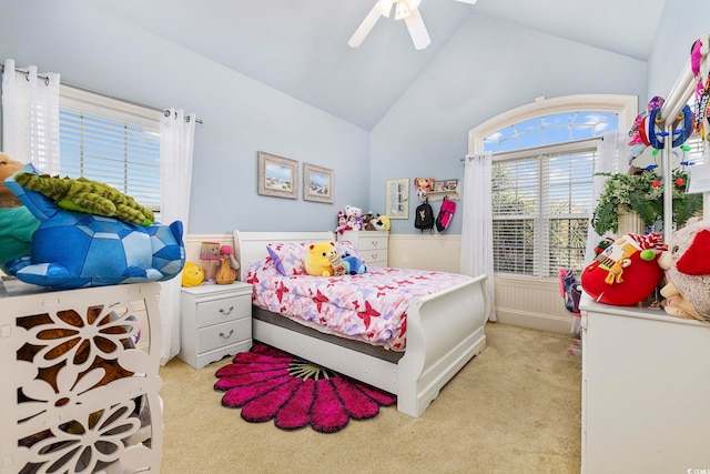 carpeted bedroom featuring ceiling fan and vaulted ceiling