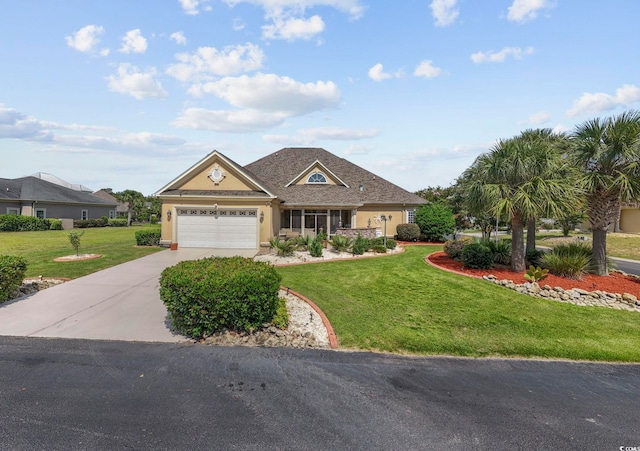 view of front facade with a garage and a front lawn