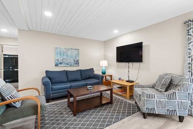 living room with wood ceiling and wood-type flooring