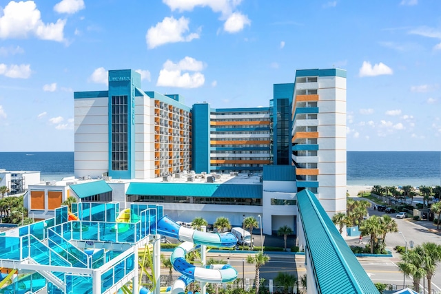 view of building exterior with a water view