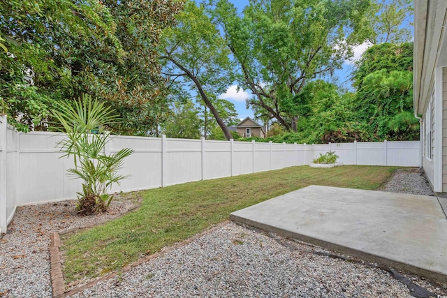 view of yard with a fenced backyard and a patio