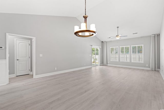 unfurnished living room featuring light wood-type flooring, visible vents, baseboards, and ceiling fan with notable chandelier