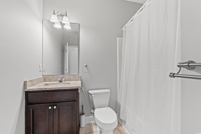 bathroom with vanity, toilet, and tile patterned floors