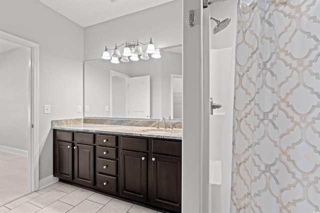 bathroom featuring vanity, walk in shower, and tile patterned floors