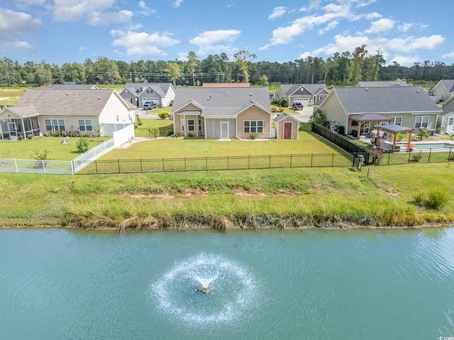 birds eye view of property with a water view