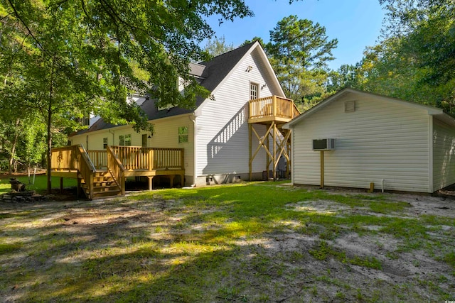 rear view of property with a deck, a lawn, and a balcony