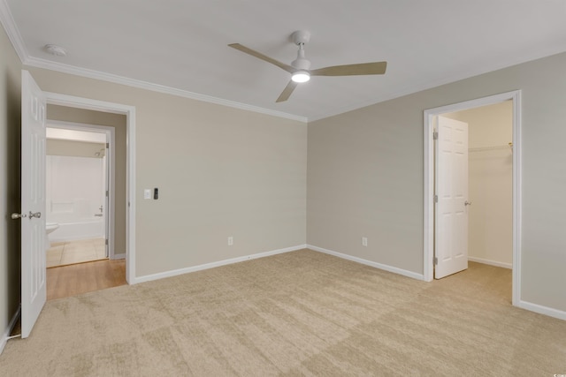3758 Loblolly Ave, Little River, SC 29566 - unfurnished bedroom featuring crown molding, baseboards, a walk in closet, ceiling fan, and carpet flooring