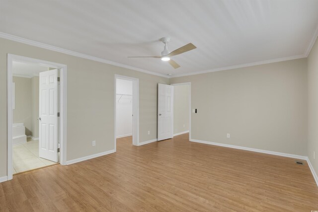 3758 Loblolly Ave, Little River, SC 29566 - unfurnished bedroom with baseboards, ornamental molding, light wood finished floors, and a spacious closet