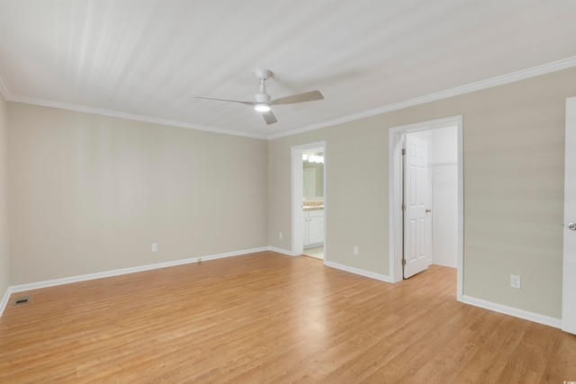 empty room featuring crown molding, light wood-type flooring, and ceiling fan