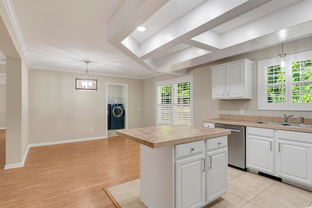 kitchen featuring dishwasher, light hardwood / wood-style flooring, a center island, pendant lighting, and white cabinetry