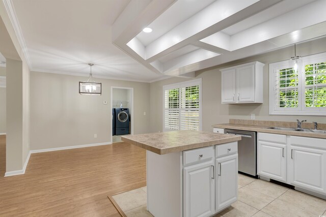 3758 Loblolly Ave, Little River, SC 29566 - kitchen with a sink, light countertops, a center island, washer / clothes dryer, and stainless steel dishwasher