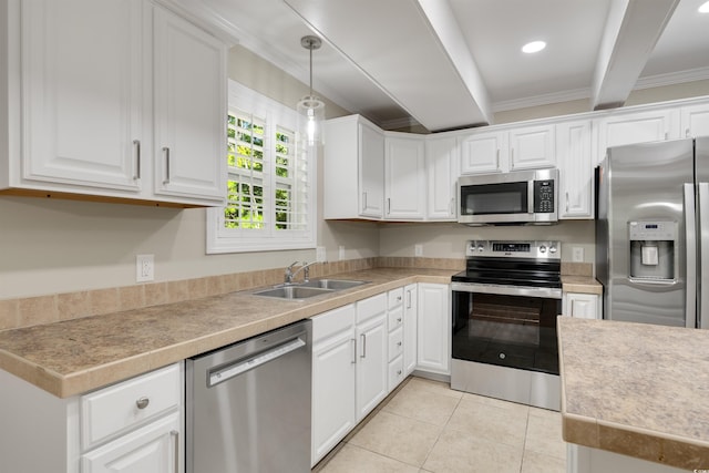 3758 Loblolly Ave, Little River, SC 29566 - kitchen with stainless steel appliances, light tile patterned flooring, white cabinetry, and a sink