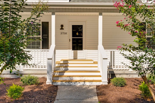 entrance to property with covered porch