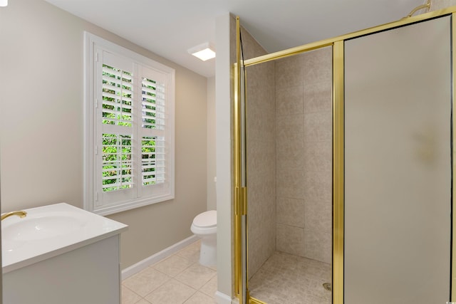 bathroom featuring toilet, walk in shower, vanity, and tile patterned flooring