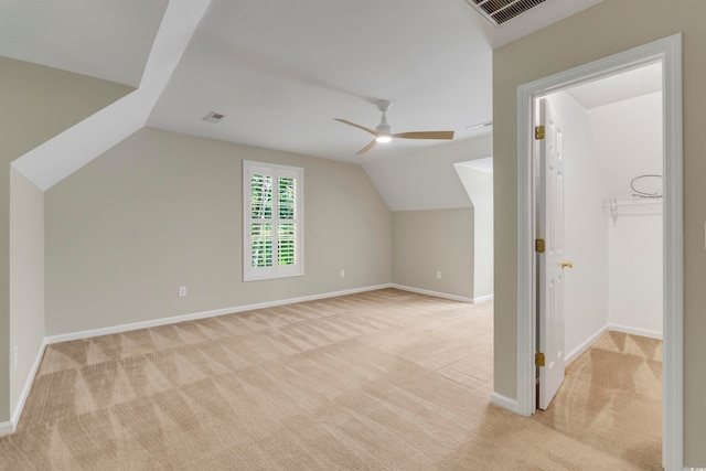 bonus room with light carpet, vaulted ceiling, and ceiling fan