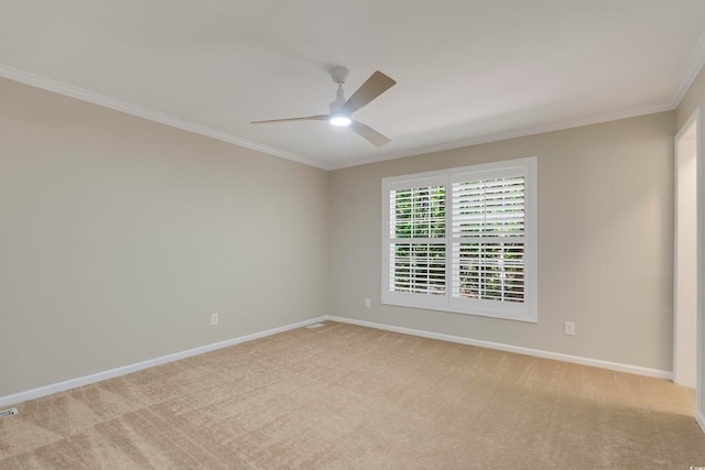 carpeted empty room with crown molding and ceiling fan