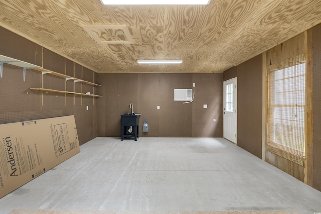 3758 Loblolly Ave, Little River, SC 29566 - interior space featuring a wood stove and an AC wall unit