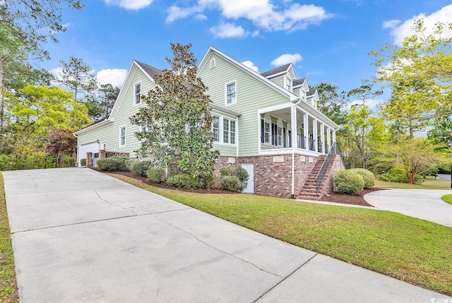 view of property exterior with a lawn and covered porch