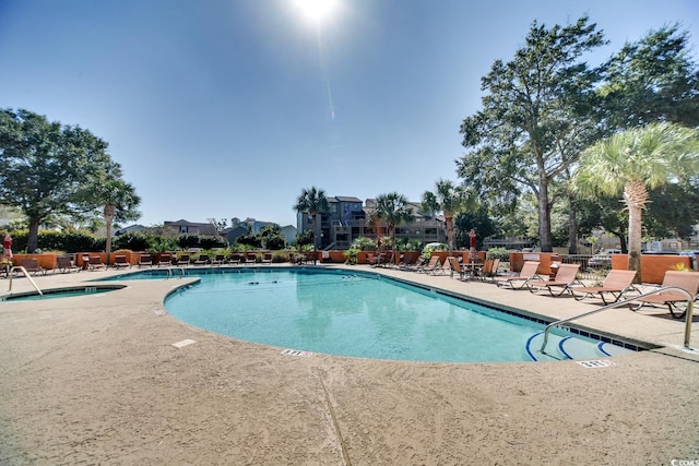 view of swimming pool featuring a patio