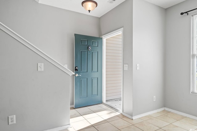 entrance foyer with light tile patterned flooring